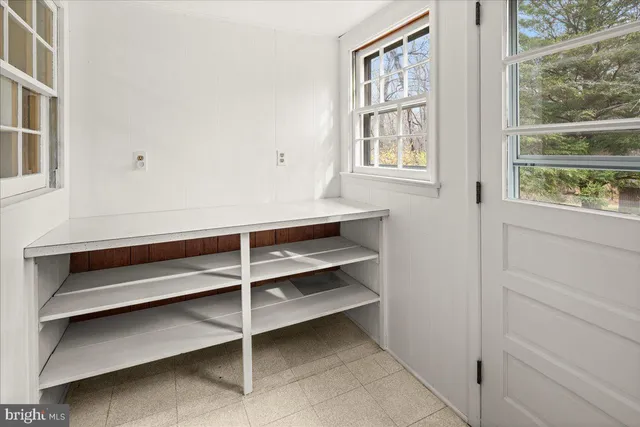 a view of storage and utility room with washer and dryer