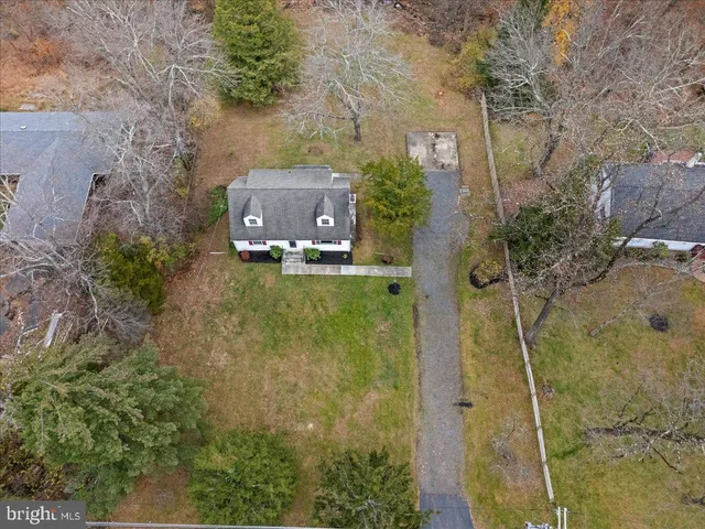 a aerial view of a house with a yard