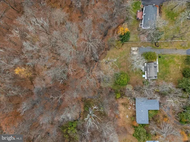 a aerial view of a house with a yard