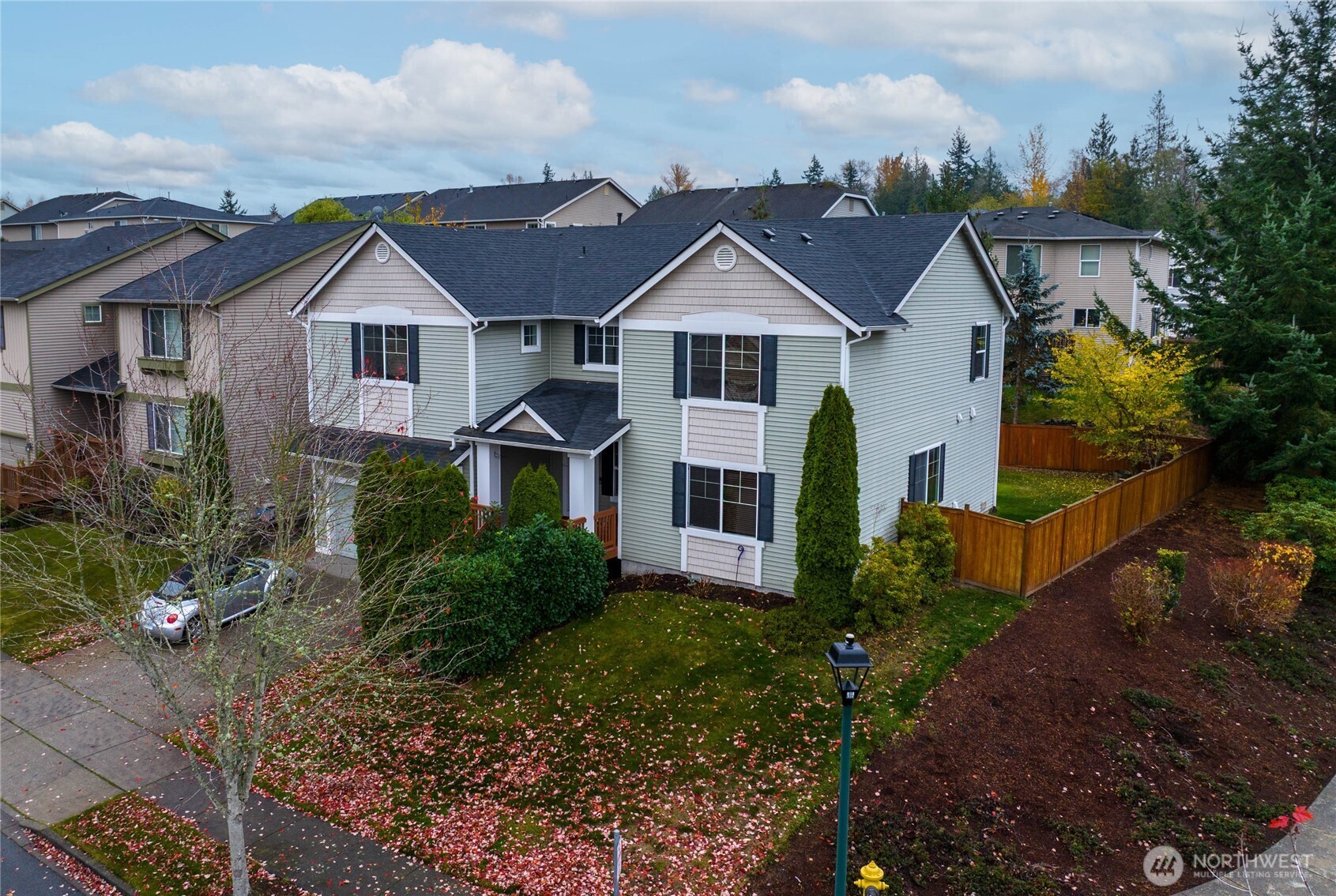 a front view of a house with garden