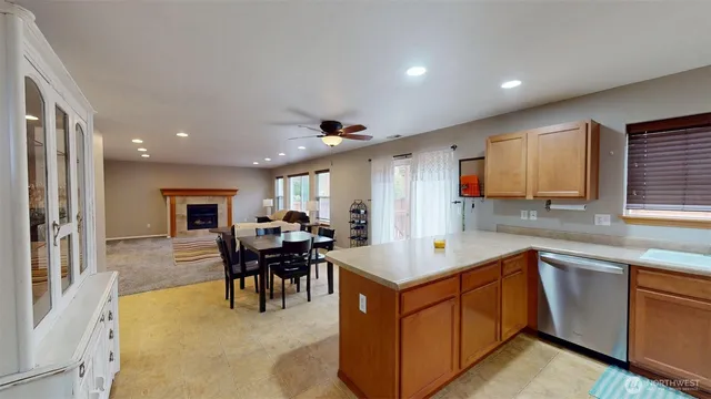 a kitchen with a sink a counter top space and stainless steel appliances