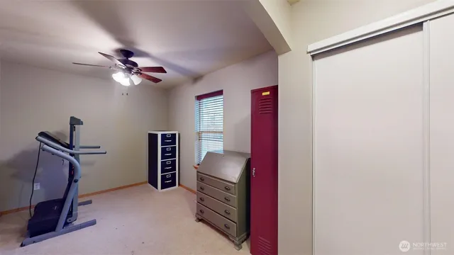 a view of room with workspace and a window