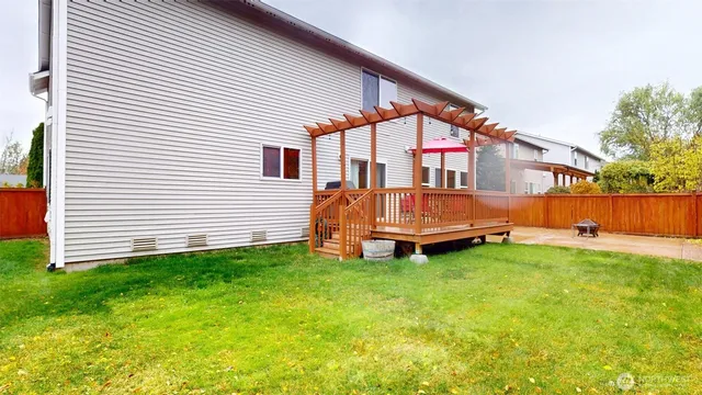 a view of backyard with deck