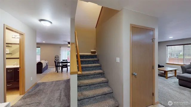 a view of a hallway with furniture and entryway