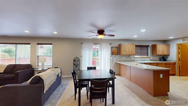 a view of kitchen with granite countertop lots of counter top space and furniture