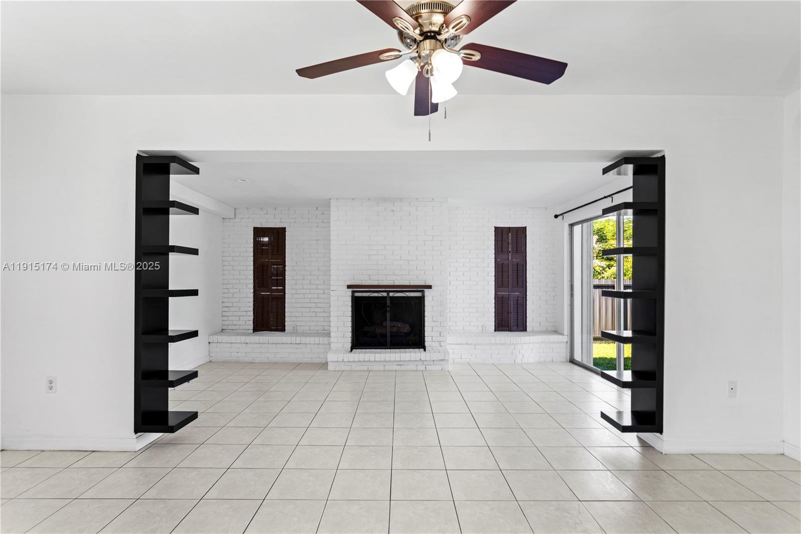 10605 Southwest 112th Street Miami, FL 33176 - Photo 14 of 44 an empty room with windows and ceiling fan