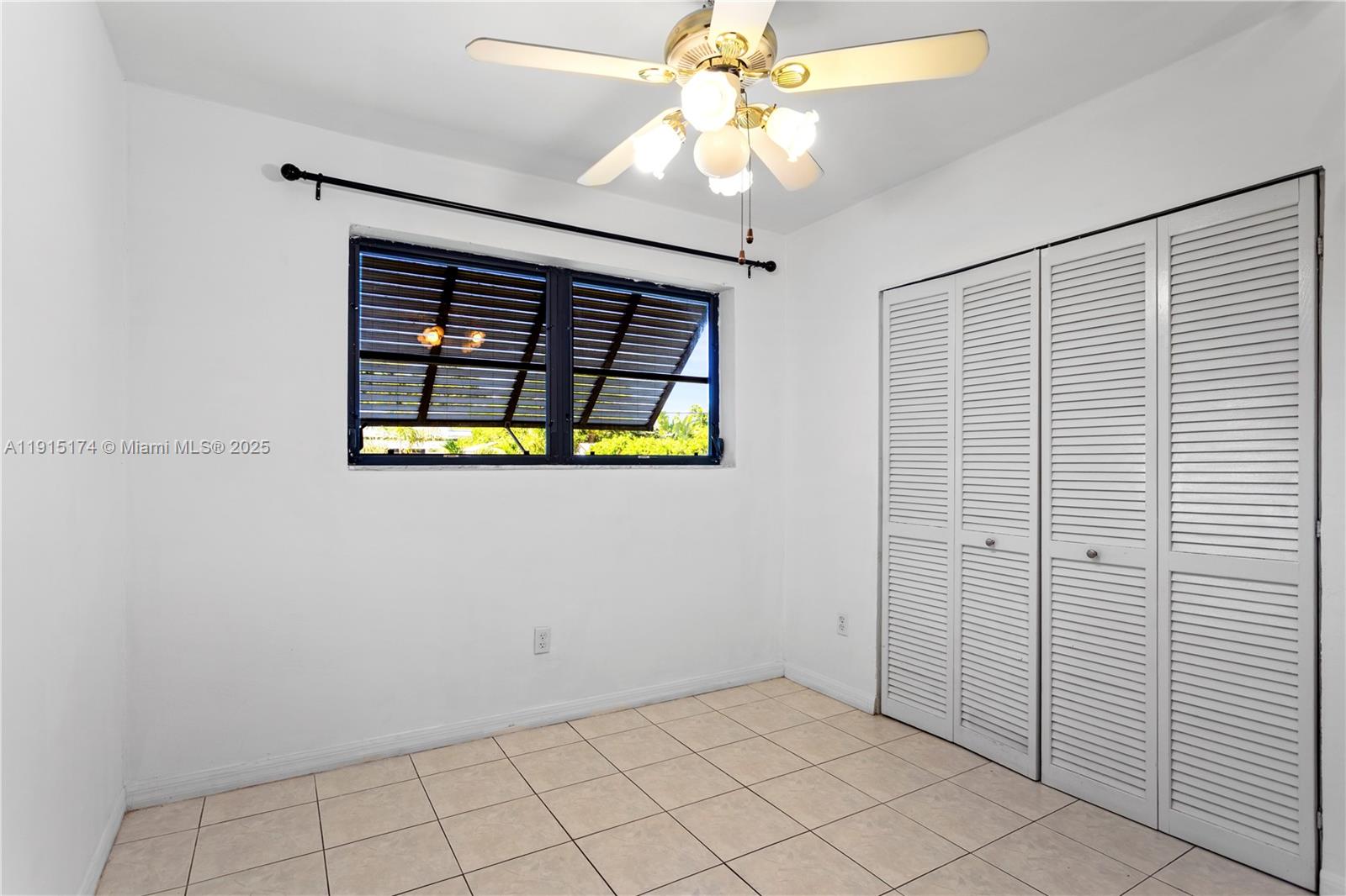 10605 Southwest 112th Street Miami, FL 33176 - Photo 20 of 44 an empty room with windows and fan