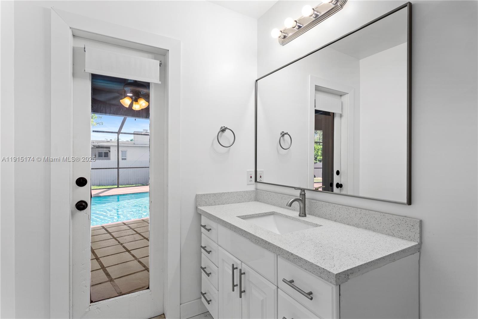 10605 Southwest 112th Street Miami, FL 33176 - Photo 25 of 44 a bathroom with a sink and a mirror