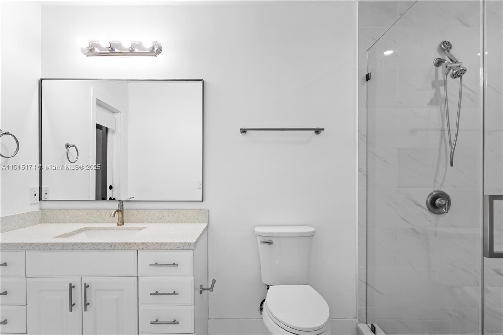 10605 Southwest 112th Street Miami, FL 33176 - Photo 26 of 44 a bathroom with a sink a toilet and shower