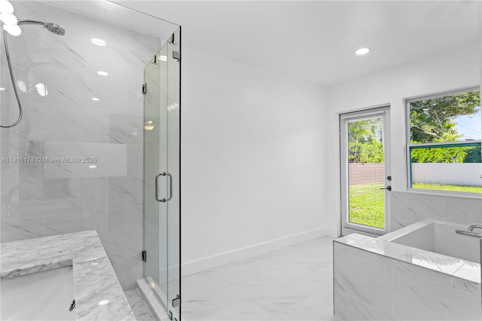 10605 Southwest 112th Street Miami, FL 33176 - Photo 29 of 44 a bathroom with a bathtub and a shower