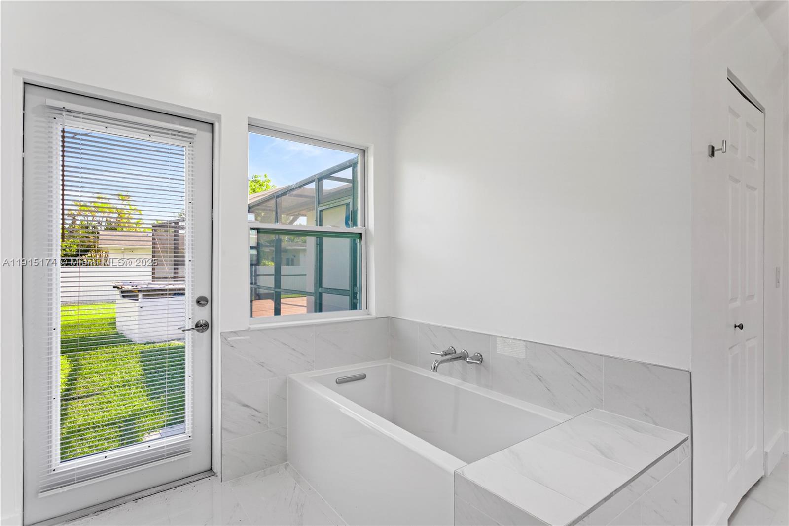 10605 Southwest 112th Street Miami, FL 33176 - Photo 30 of 44 a bathroom with a tub sink and window