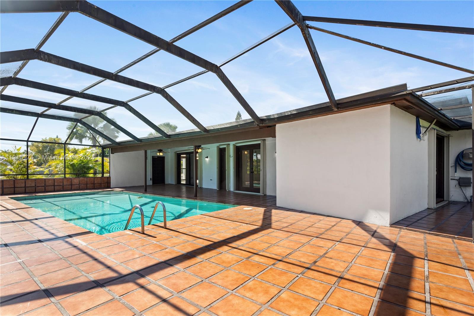 10605 Southwest 112th Street Miami, FL 33176 - Photo 33 of 44 a house with yard in front of it