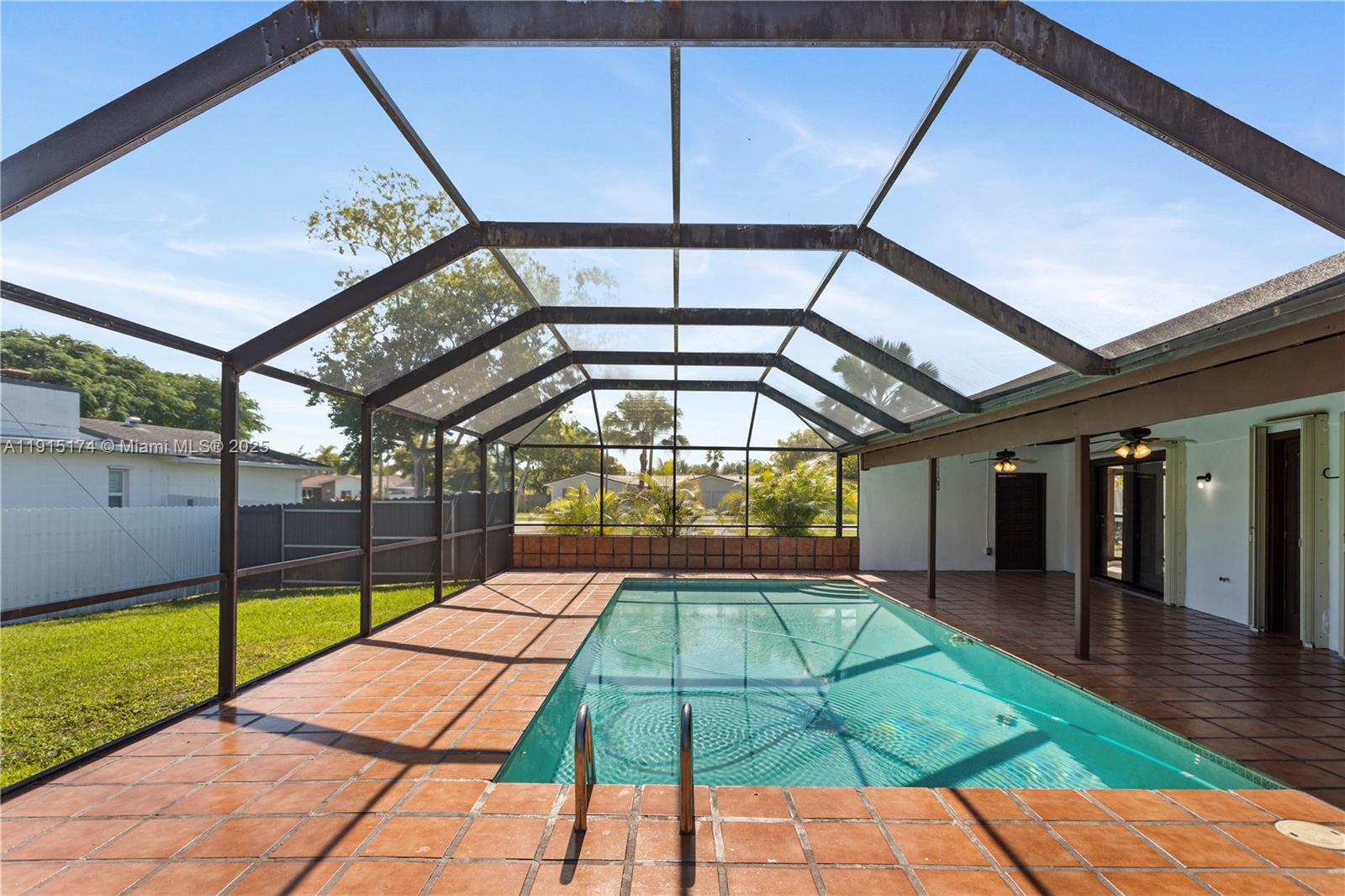 10605 Southwest 112th Street Miami, FL 33176 - Photo 34 of 44 a view of a swimming pool with a porch