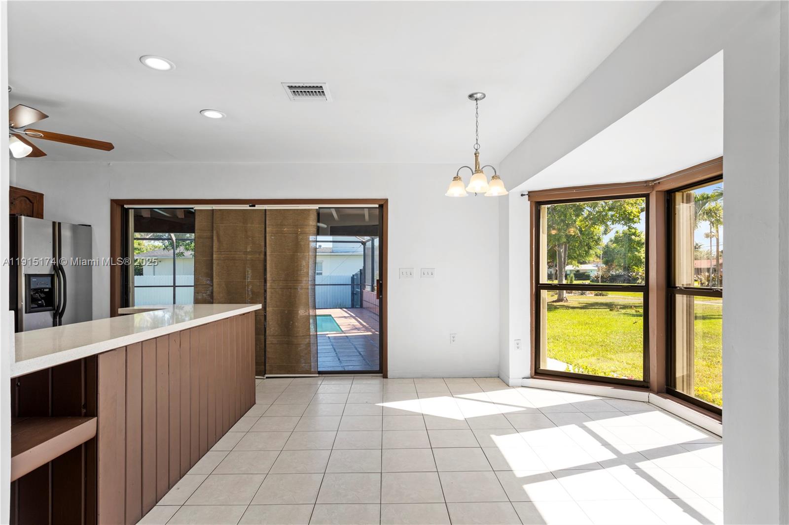 10605 Southwest 112th Street Miami, FL 33176 - Photo 9 of 44 a view of a room with large windows