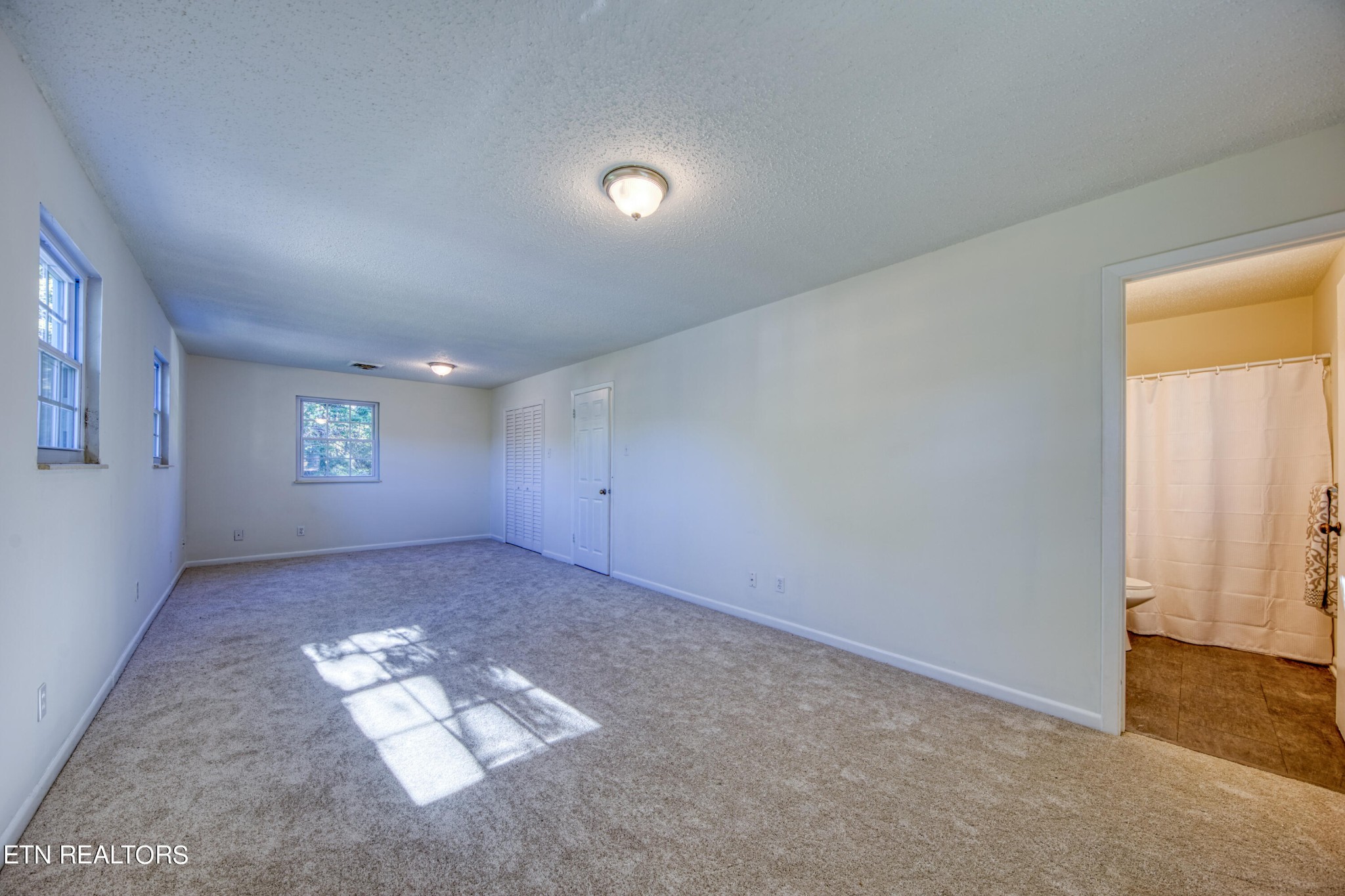 7329 Joyce Lane Powell, TN 37849 - Photo 13 of 28 an empty room with windows and closet