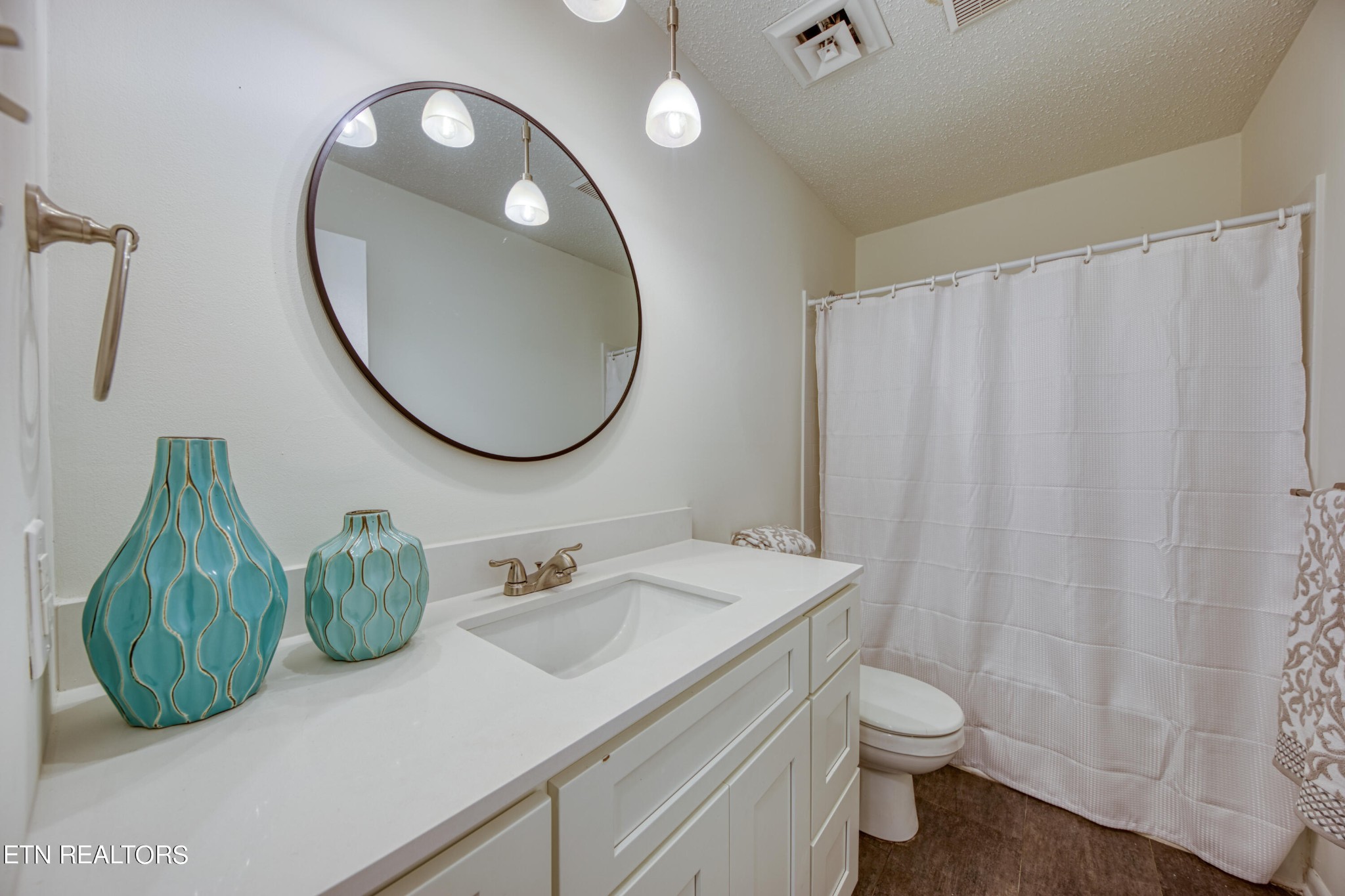 7329 Joyce Lane Powell, TN 37849 - Photo 18 of 28 a bathroom with a sink mirror and toilet