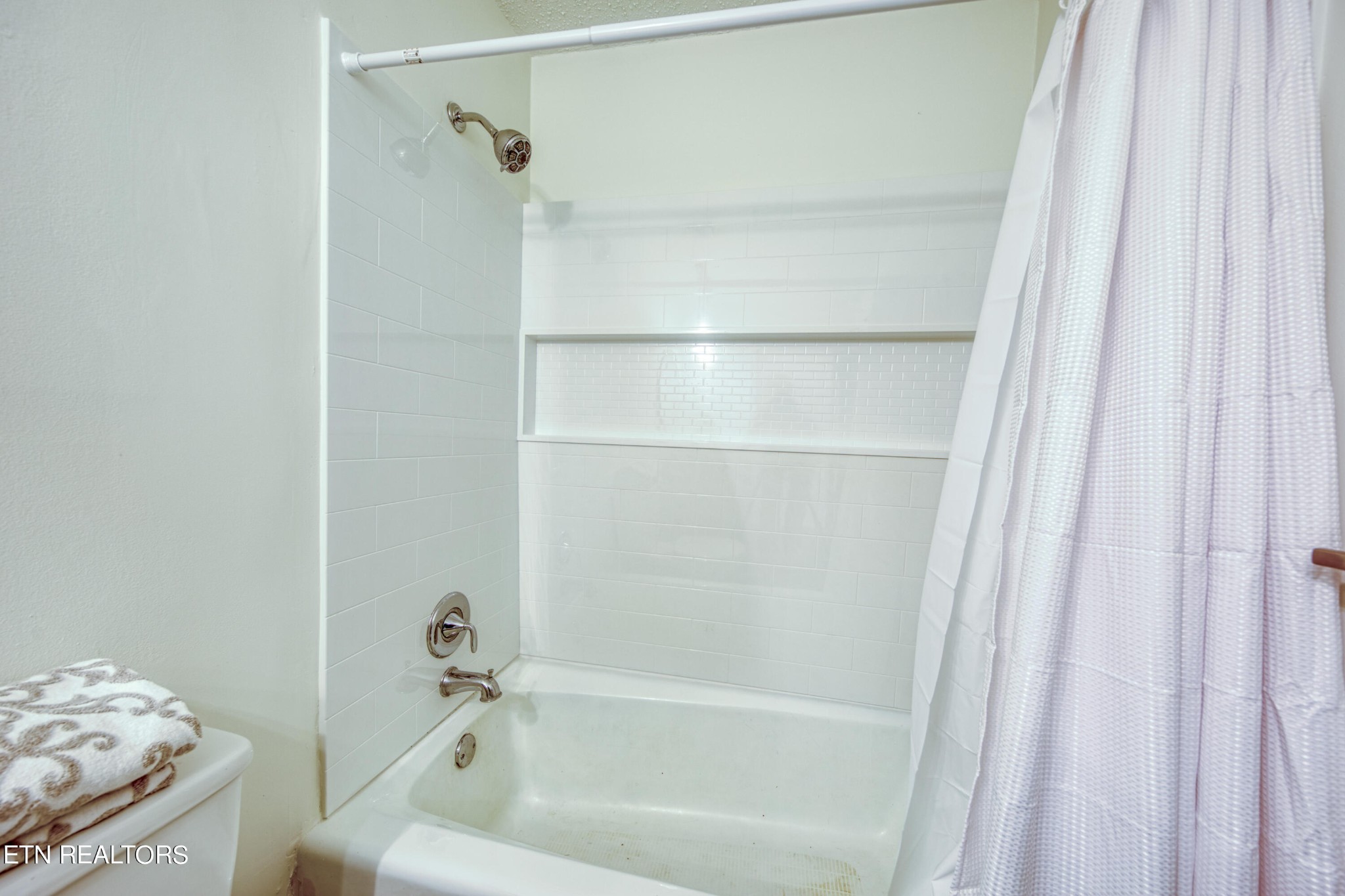 7329 Joyce Lane Powell, TN 37849 - Photo 19 of 28 a bath tub sitting next to a window