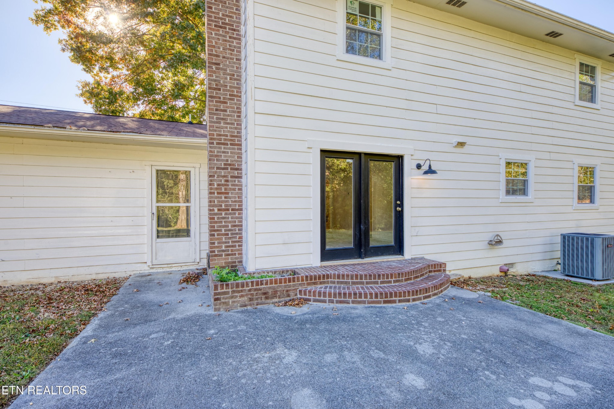 7329 Joyce Lane Powell, TN 37849 - Photo 22 of 28 a view of house with backyard and glass windows