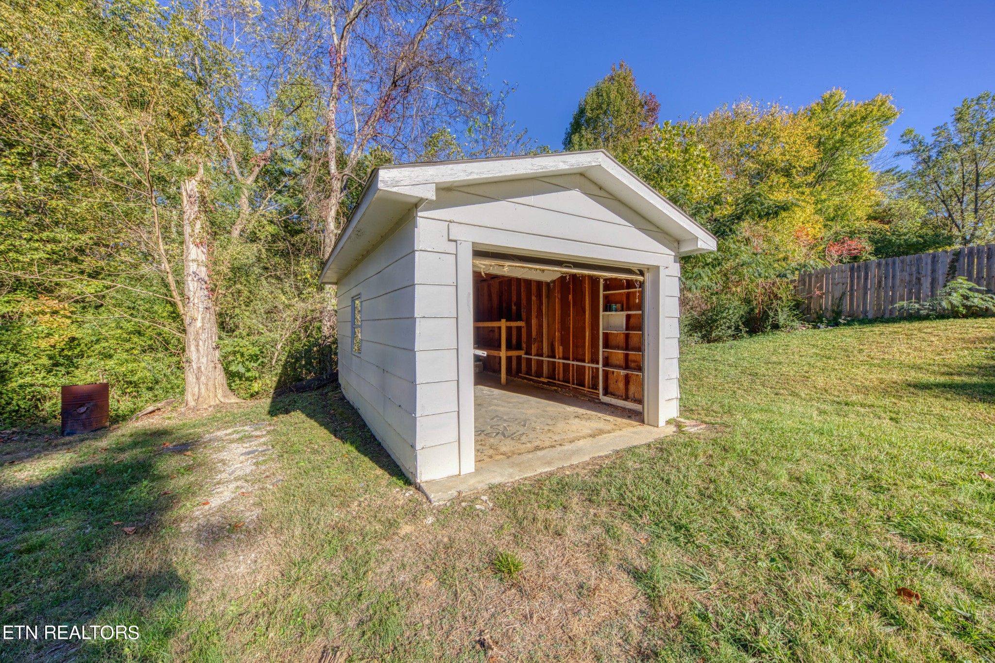 7329 Joyce Lane Powell, TN 37849 - Photo 24 of 28 a view of a house with a small yard and a large tree