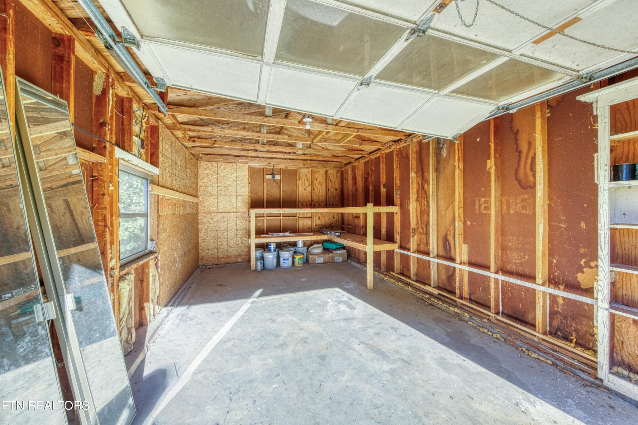 7329 Joyce Lane Powell, TN 37849 - Photo 25 of 28 a view of an empty room with a birdcage and a chair