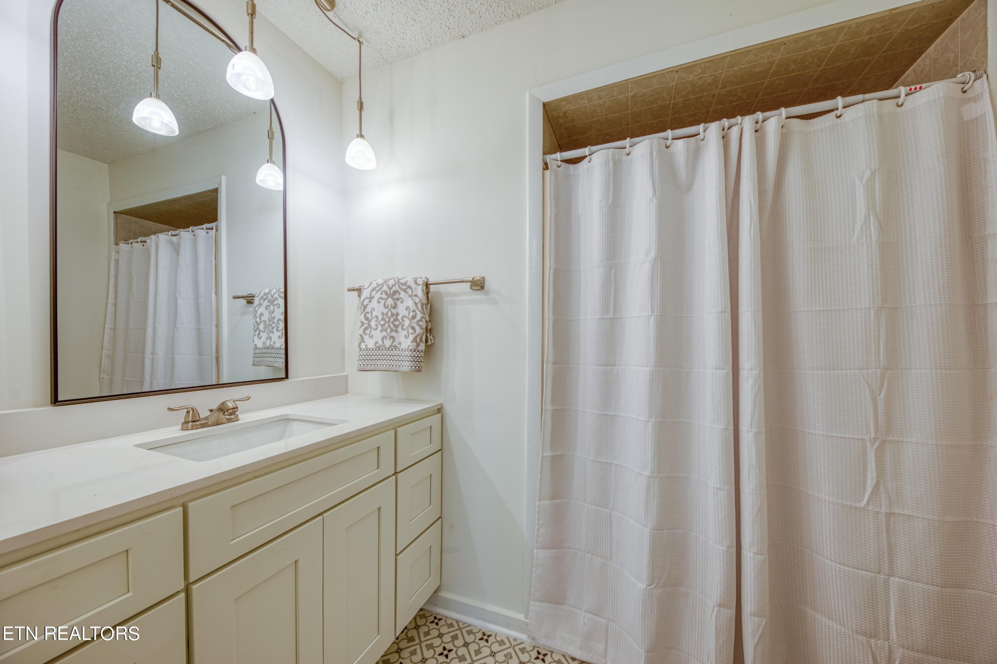 7329 Joyce Lane Powell, TN 37849 - Photo 10 of 28 a bathroom with a sink and a mirror