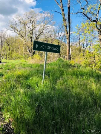 a view of swimming pool with a yard