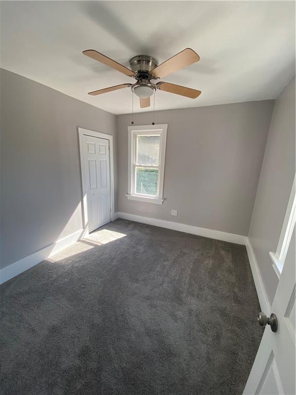 311 South 3rd Avenue Elizabeth, PA 15037 - Photo 17 of 30 an empty room with a ceiling fan and windows