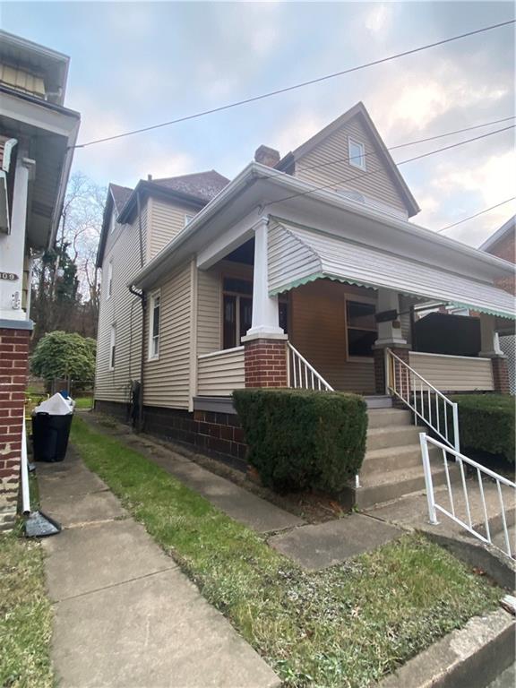 311 South 3rd Avenue Elizabeth, PA 15037 - Photo 2 of 30 a front view of a house with garage
