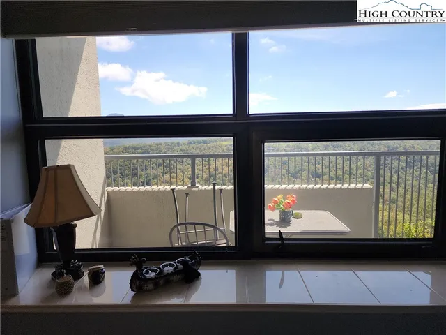 a living room with couches and a flat screen tv