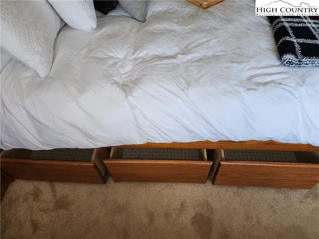 a bedroom with bed and window