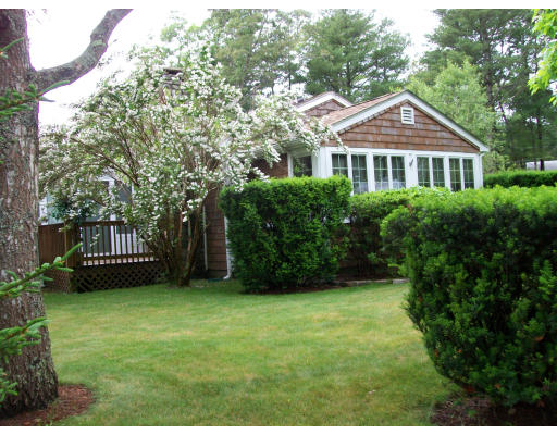 26 Monack Road Wareham, MA 02532 - Photo 1 of 1 a view of a house with a yard and a garden