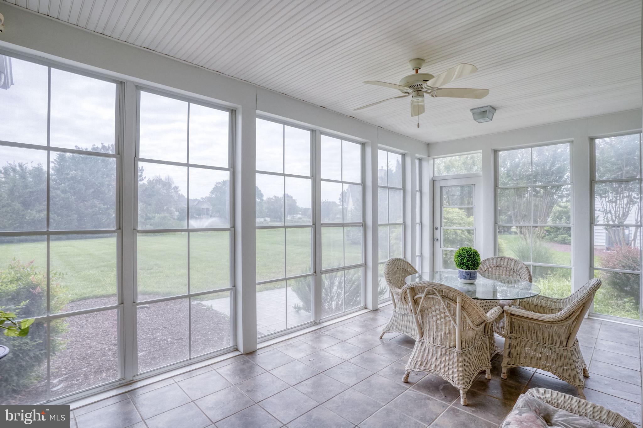 36 Kenmare Way Rehoboth Beach, DE 19971 - Photo 19 of 62 Screen porch overlooks pond and private yard.