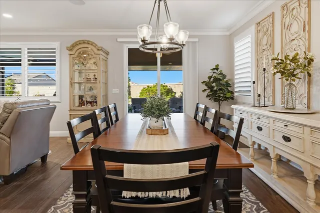 a kitchen with granite countertop white cabinets and stainless steel appliances
