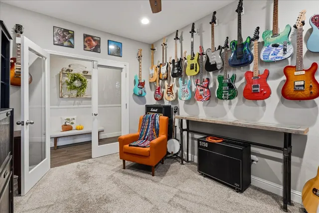 a bathroom with a granite countertop sink a large mirror a bathtub and shower