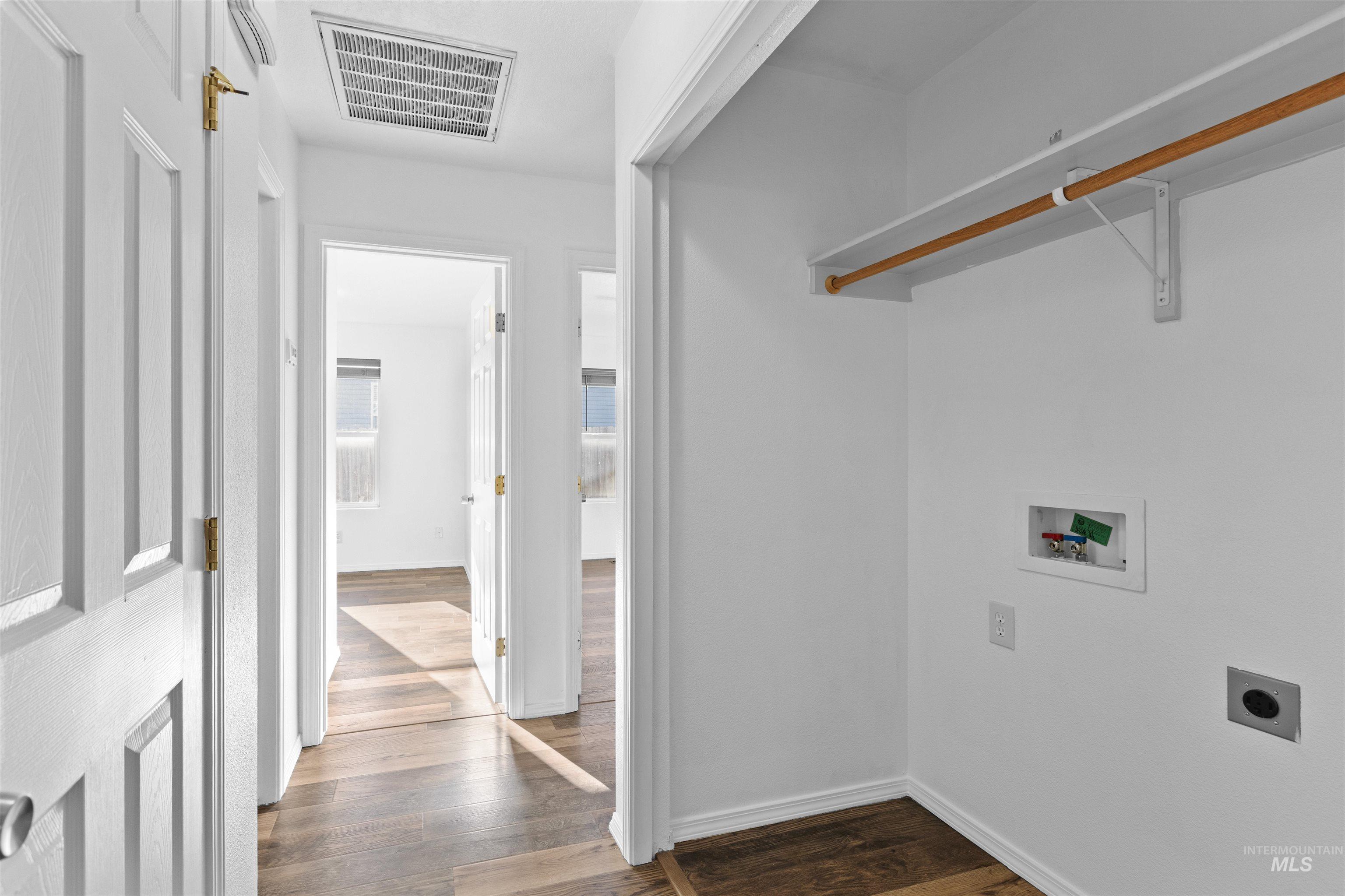 16535 Chino Avenue Caldwell, ID 83607 - Photo 16 of 26 Laundry area with hookup for a washing machine, dark wood-type flooring, and hookup for an electric dryer