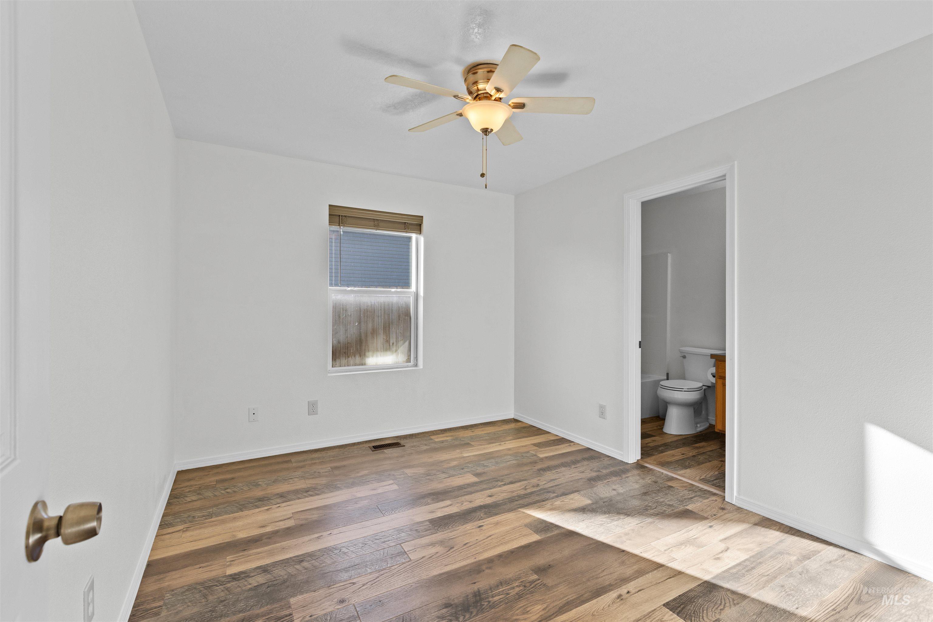 16535 Chino Avenue Caldwell, ID 83607 - Photo 19 of 26 Spare room with hardwood / wood-style flooring and ceiling fan