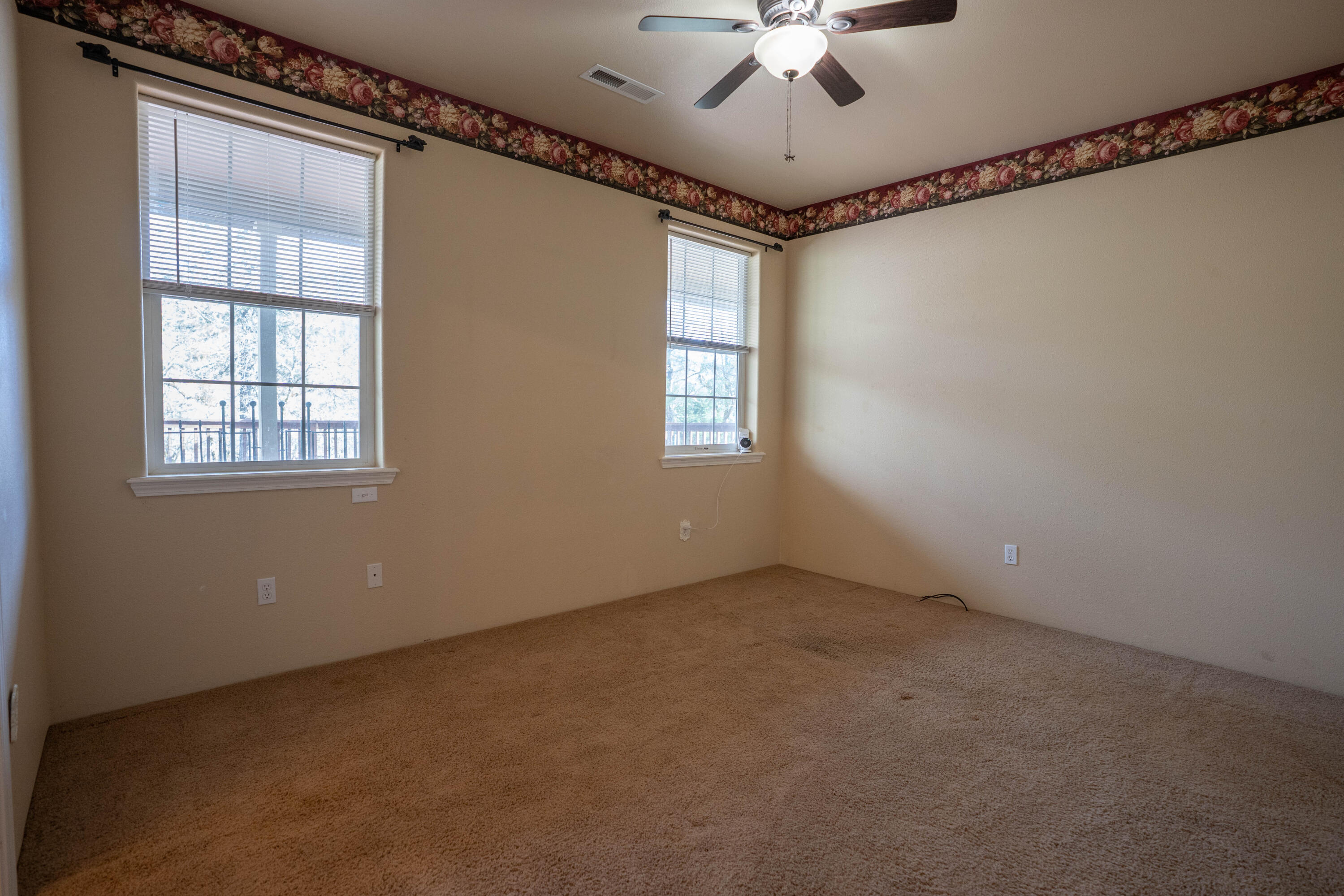 2080 Swingle Road Trail, OR 97541 - Photo 35 of 52 Third bedroom featuring two generous windows that fill the rooms with natural light.