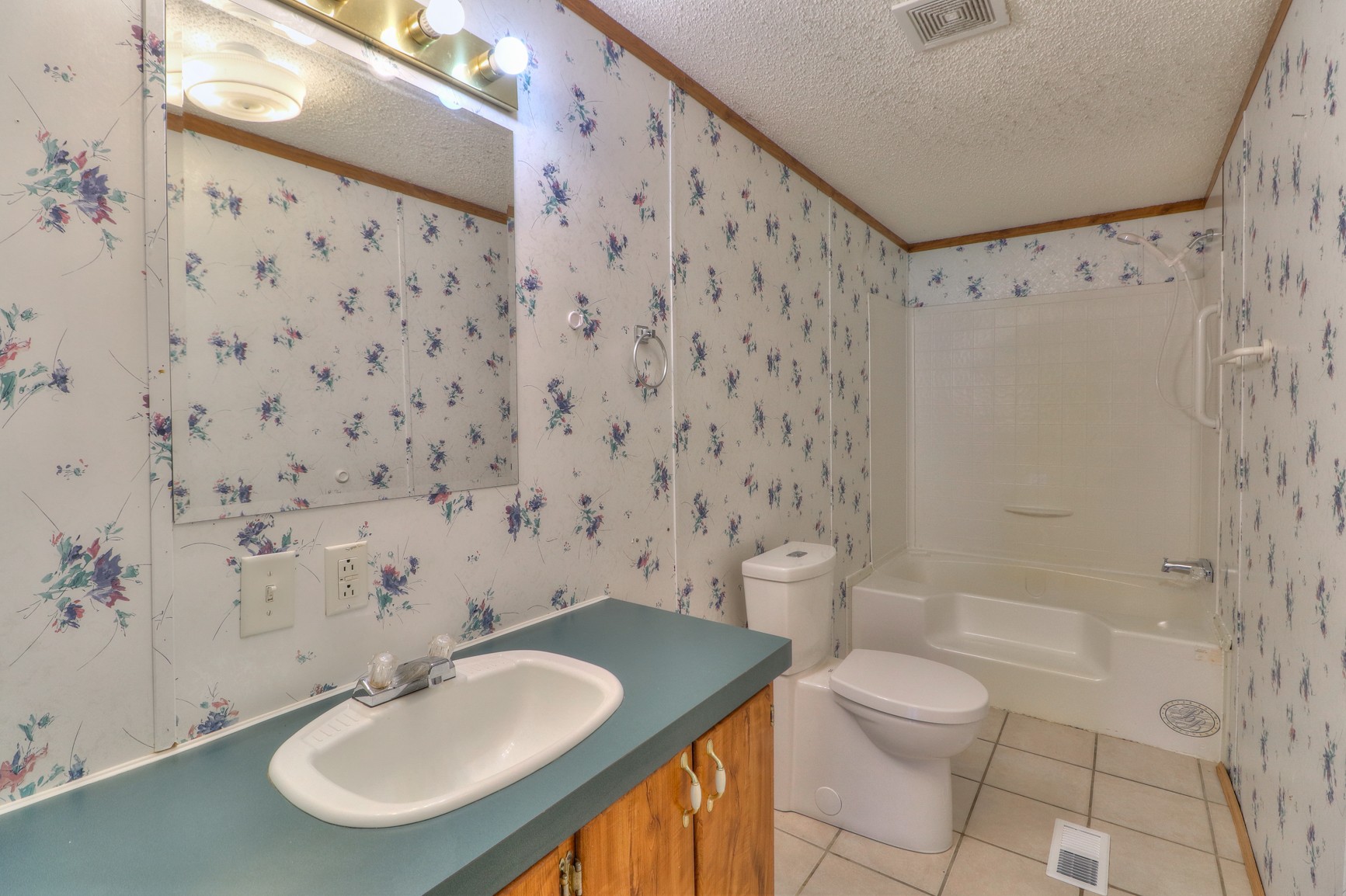 1489 Pleasant View Road Woodbury, TN 37190 - Photo 15 of 29 a bathroom with a sink toilet and shower