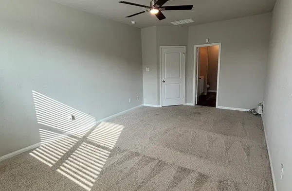 a spacious bathroom with a sink a toilet and shower