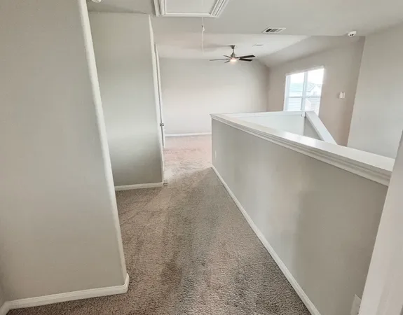 a view of an empty room and window