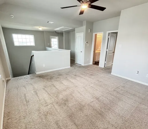 a en suite bathroom with a double vanity sink and a mirror