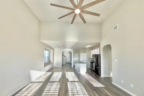a view of a hallway with a livingroom
