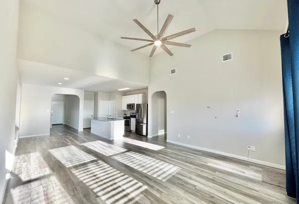 a view of a room with a ceiling fan