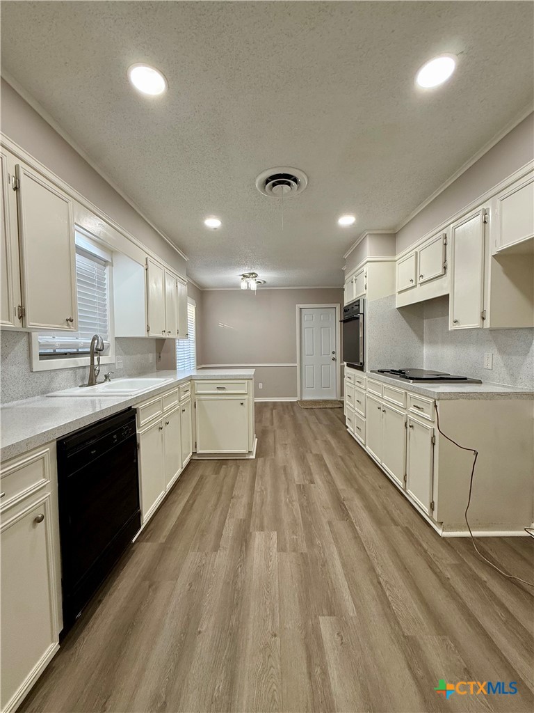 2407 East Airline Road Victoria, TX 77901 - Photo 12 of 38 a large kitchen with cabinets