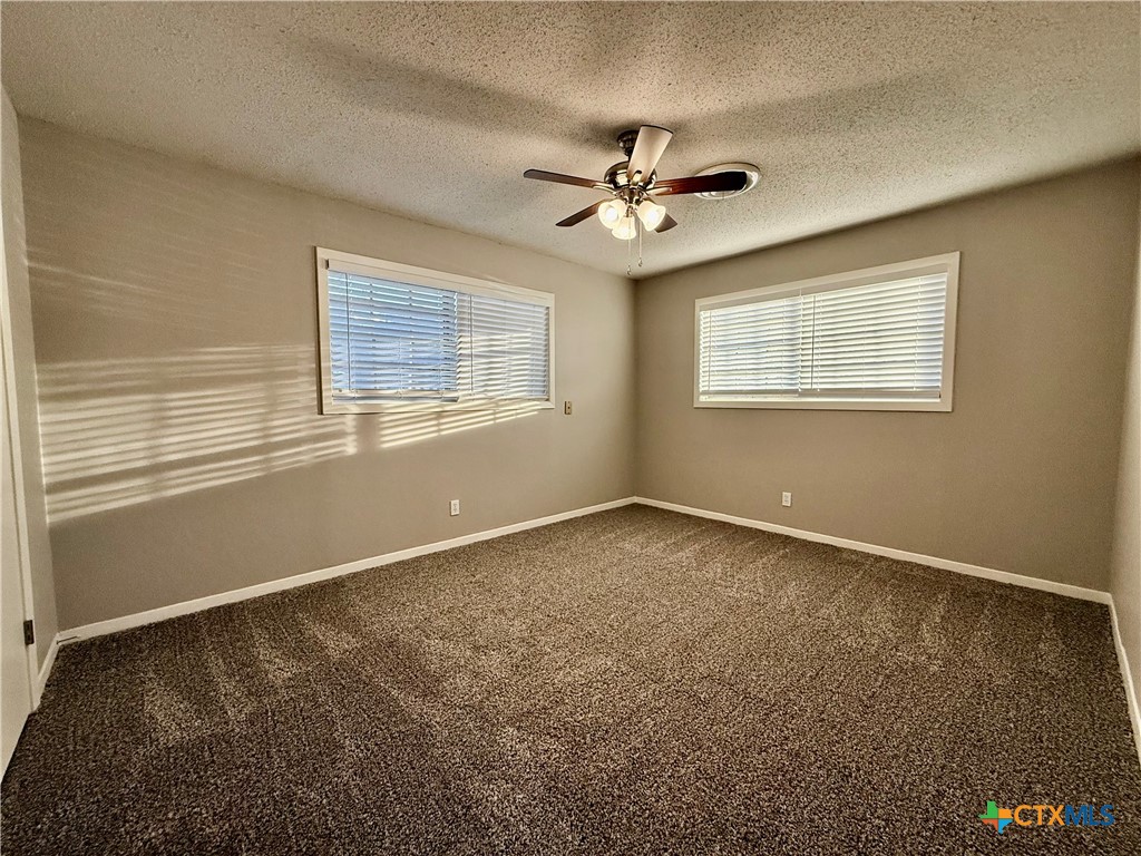 2407 East Airline Road Victoria, TX 77901 - Photo 17 of 38 a view of an empty room with a window