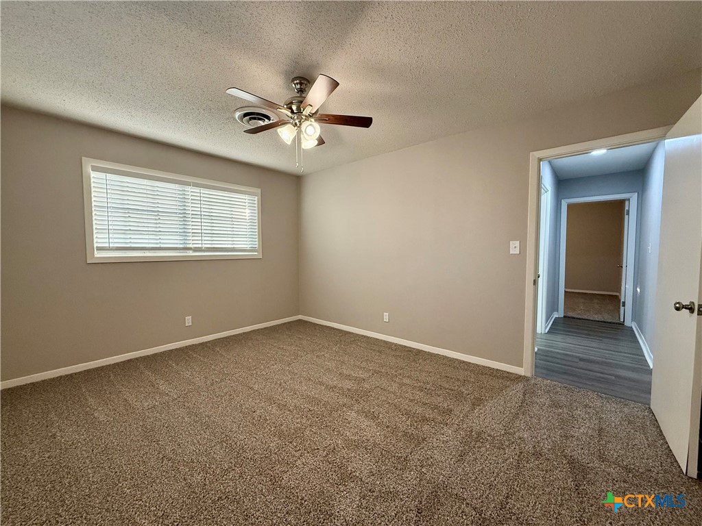 2407 East Airline Road Victoria, TX 77901 - Photo 18 of 38 a view of an empty room with a window