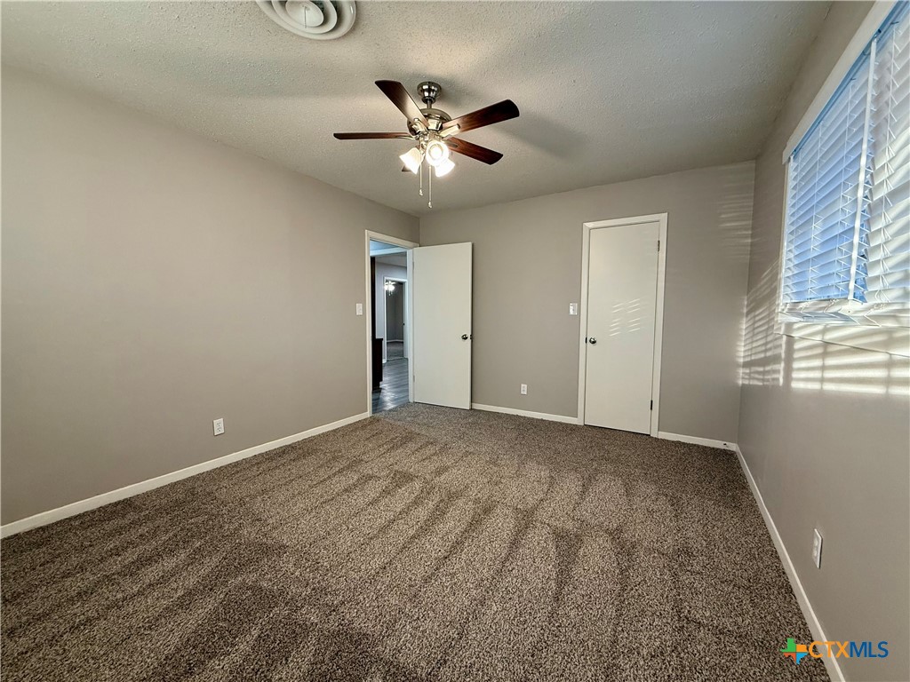 2407 East Airline Road Victoria, TX 77901 - Photo 19 of 38 a view of an empty room with a window