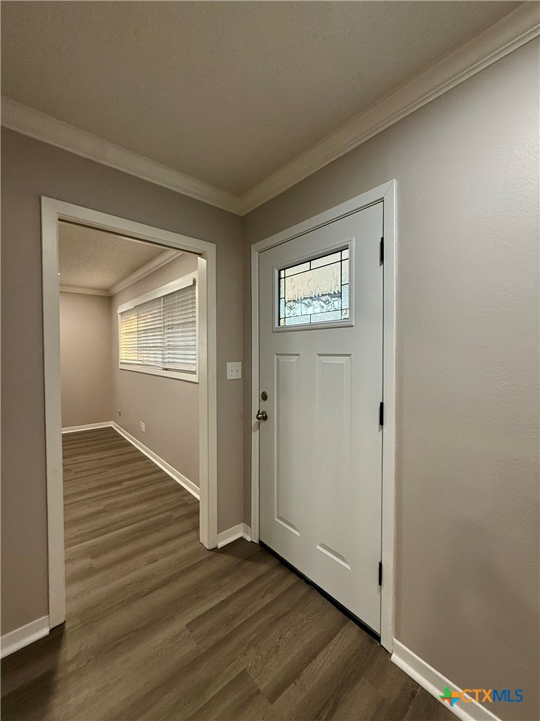 2407 East Airline Road Victoria, TX 77901 - Photo 2 of 38 an empty room with wooden floor closet and windows