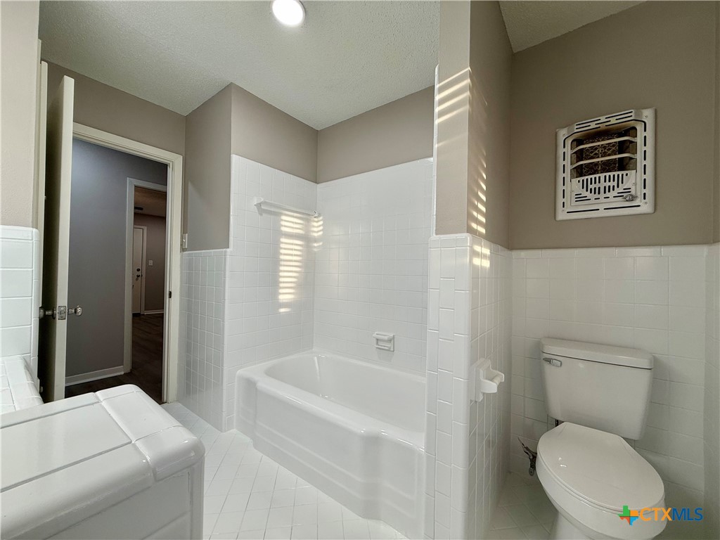 2407 East Airline Road Victoria, TX 77901 - Photo 25 of 38 a bathroom with a toilet and a shower