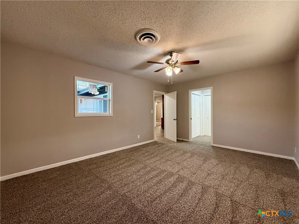 2407 East Airline Road Victoria, TX 77901 - Photo 28 of 38 a view of an empty room with a chandelier fan